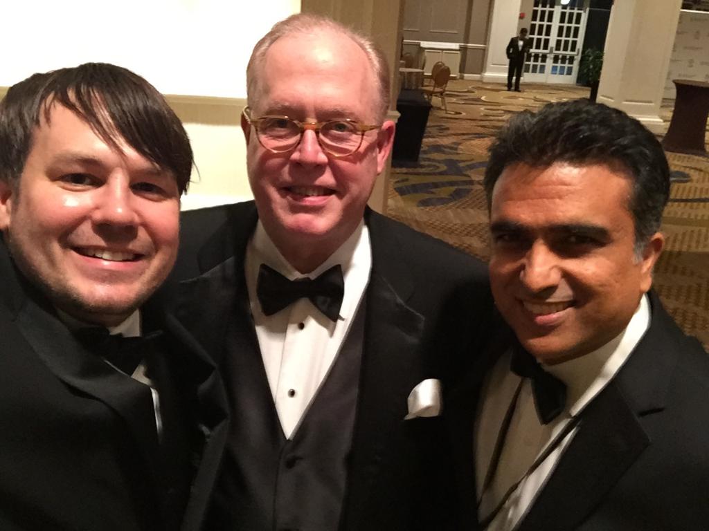 Dr. Gardner, Dr. Wheeler and Dr. Mohan in formal attire, smiling together